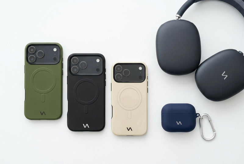 Olive Green, Onyx Black, and Ivory Silk slim MagSafe iPhone cases lined up with Graphite AirPods Max headphones and Midnight Blue silicone AirPods case with carabiner — VitaAurea Minimalist Design Collection.