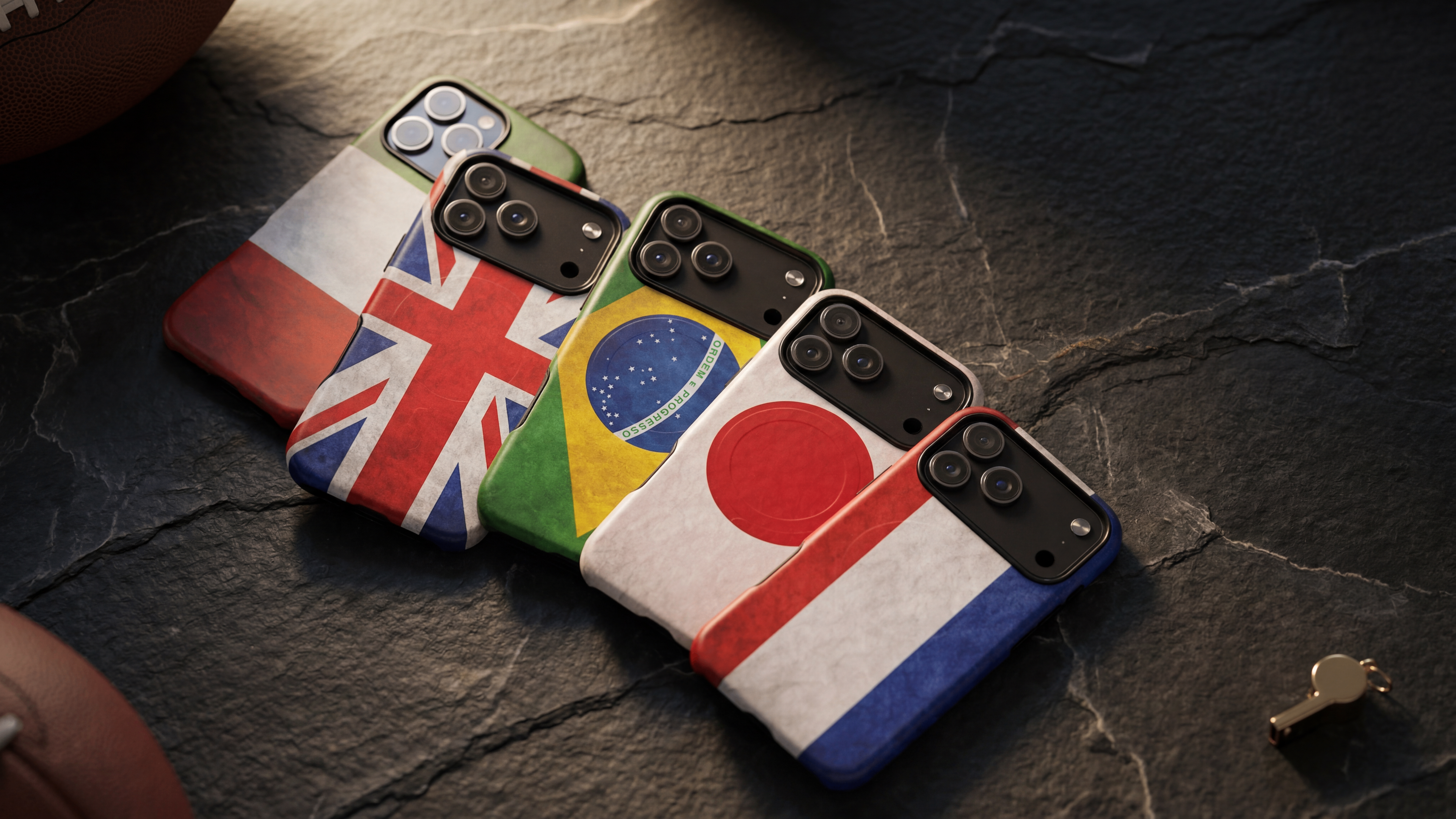 Four VitaAurea Flags Cases with different country flags on their backs, placed on a dark stone surface.