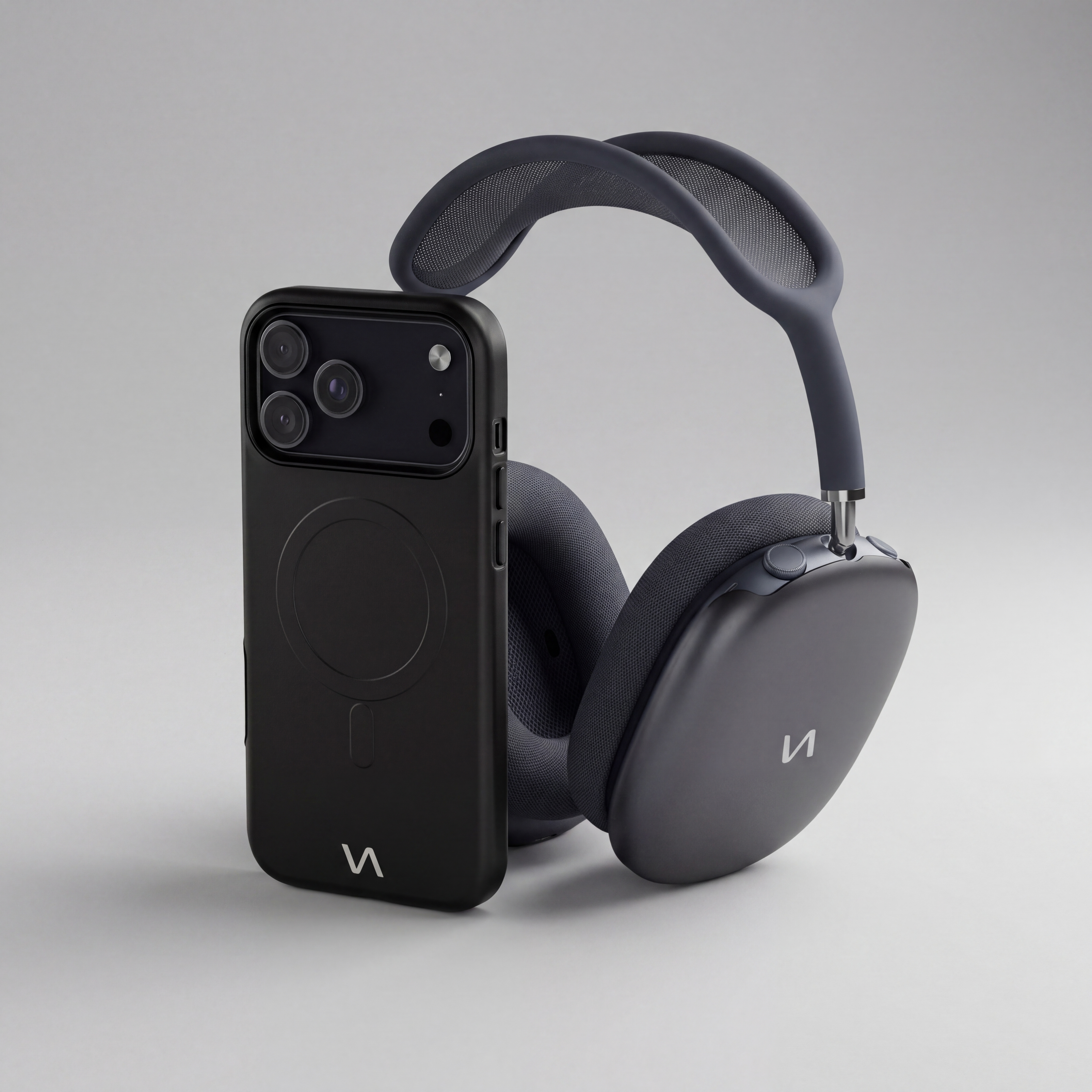 Onyx black MagSafe iPhone case front with matching AirPods Max ear cup covers.